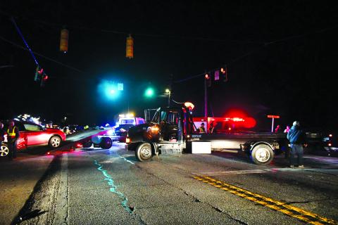 Megan Broome/The Clayton Tribune. Rabun County first responders work the scene of a two-vehicle crash on Georgia 15 at the intersection of Highway 246 in Dillard on Dec. 1. One motorist was charged following the crash.
