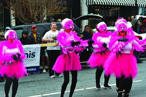 Enoch Autry/The Clayton Tribune. The “Most Original Costumes and Decorations” category winner in the Dec. 3 downtown Clayton Christmas Parade was five female club members dressed as feathery pink dancing flamingos from the Kiwanis Club of Rabun County.