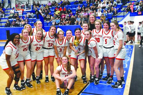 Enoch Autry/The Clayton Tribune. The Lady Cats claim the Battle of the States title with a 66-42 victory on Dec. 30 over Franklin (N.C.) High School.