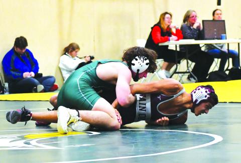 Luke Morey/The Clayton Tribune. Rabun Gap-Nacoochee junior Clay Unruh grapples with Swain County’s Randall Jenkins on his way to a victory on Tuesday, Jan. 10. Unruh is looking to go for back-to-back state titles after winning the 132 title last year.