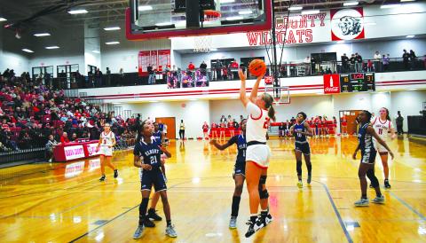 Luke Morey/The Clayton Tribune. In front of a packed gym on Friday, Jan. 20, RCHS junior Ellie Southards lays in a basket in the third quarter against last year’s state champ Elbert County. In the first rematch between Elbert and RCHS since last year’s GHSA AA state title game, the Lady Cats won 55-49.