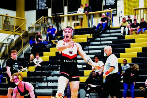 Luke Morey/The Clayton Tribune. Rabun County senior Miles Watts reacts after defeating Brayden Phillips in the first place match at the area tournament at Commerce on Saturday, Feb. 4.  Watts scored the winning points over Phillips with 15 seconds remaining in the final period. 