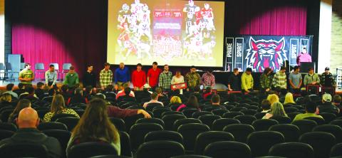 Luke Morey/The Clayton Tribune. On Sunday, Feb. 5, Rabun County High School honored the 2022 football team after their 12-1 season. RCHS head coach Michael Davis (pictured speaking) addressed the 19 seniors after their final season as  Wildcats. The seniors went 47-6 overall with a 16-0 region record. Pictured with the 19 seniors is senior student manager Molly Jo Wright (center).
