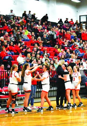 Luke Morey/The Clayton Tribune. The three Lady Cat seniors receive an ovation as they check out of their second to last home game of the regular season. From left, the seniors include Bailey Maloney, Mary Lovell and Trea Blalock. 