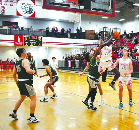 Luke Morey/The Clayton Tribune. RCHS junior Willie Goodwyn goes up for a shot in the fourth quarter against Tallulah Falls on Friday, Feb. 10. Goodwyn had his best game of the season, ending with 25 points and 20 rebounds in a 71-41 victory. The Wildcats are the No. 2 seed in the region tournament, taking on Tallulah Falls again on Thursday, Feb. 16. 