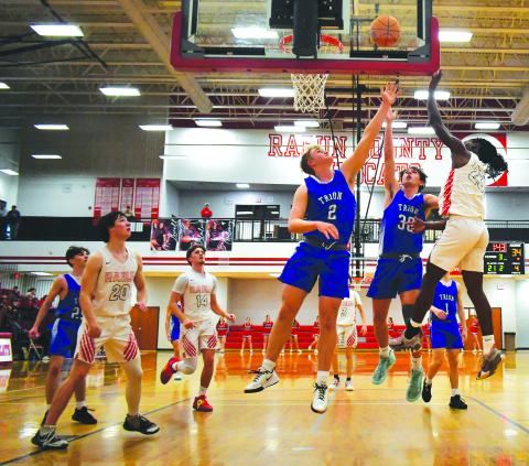 Luke Morey/The Clayton Tribune. RCHS junior Willie Goodwyn collects a rebound and puts the shot back in on Tuesday, Feb. 21 against Trion in the first round of the GHSA State Playoffs. Goodwyn helped stave off a late comeback, with 25 points to propel the Wildcats into the Sweet Sixteen.