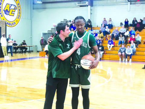 TFS Athletics. TFS senior Anfernee Hanna receives a game ball from TFS coach Cody Coleman after a game against Athens Christian on Friday, Jan. 20. During the game, Hanna surpassed 1,000 career points for his career. In the games following, Hanna became the all-time leader in wins with 62 and counting. Hanna and the TFS basketball team have three more games untl the region tournament begins on Monday, Feb. 13. 