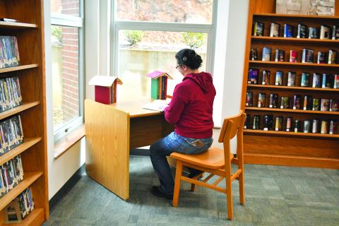 Megan Broome/The Clayton Tribune. Rabun County Public Library Branch Manager Dyana Costello Banks demonstrates one of the new “study nook” areas that will be available to patrons throughout the library when it reopens Feb. 6. These areas are one of the new features offered from renovations made in the library over the past month. 