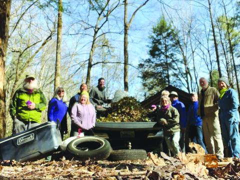 Submitted photo. Georgia ForestWatch Board members volunteer to remove 300 pounds of invasive plants and trash before many spring wildflowers emerge at the Warwoman Dell recreation area just outside Clayton. 