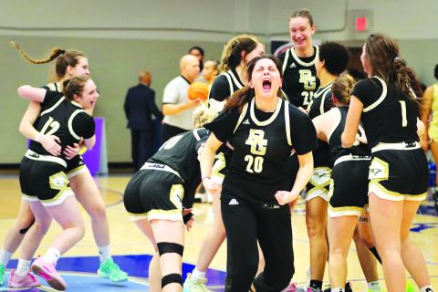 RGNS Athletics. Rabun Gap-Nacoochee School senior Ece Arabacioglu (20) celebrates a second straight state championship with her Lady Eagle teammates in the background on Saturday, Feb. 24. The Lady Eagles secured back-to-back state titles with a 53-43 victory over Cannon School at Calvary Day School. RGNS finished the season with a 25-7 record.