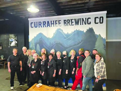 Submitted photo. Volunteers at the Currahee Brewing Company nonprofit night March 2 show support to the Food Bank of Northeast Georgia Food 2 Kids Program as the community came out and raised $2,900. 