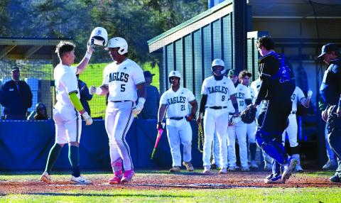Luke Morey/The Clayton Tribune. Keilin Sanders congratulates Armani Guzman (5) after Guzman’s home run that brought Sanders home in the home opener on Thursday, March 15. Guzman and Sanders helped lead the Eagles to a 15-0 victory in three innings. The Rabun Gap Eagles, after a season where they went to the Final Four, have gotten off to a 8-0 start to the season. The Eagles take on Tallulah Falls at home on Thursday, March 23. 