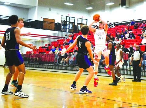 Luke Morey/The Clayton Tribune. Junior Cooper Welch goes up for a shot early in the third quarter against King’s Ridge. Welch was the sole returning starter from last year’s team that also made it to the Sweet Sixteen. Welch led the team in scoring this year, but rolled his ankle in the middle of the third quarter against King’s Ridge, finishing with six points in the final game of his junior season. 