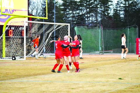 Luke Morey/The Clayton Tribune. Lady Cat Abby Sego (center) celebrates with Quetzaly Diaz, 7, and Aurora Barcenas after Diaz’s goal against Hart County on Thursday, March 2. The Lady Cats fell to Tallulah Falls on Tuesday, March 7. The RCHS girls next travel to take on Athens Christian on Friday, March 10, to start a three-game road trip. 