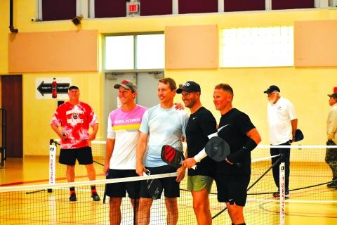 Luke Morey/The Clayton Tribune. The Rabun County Recreation Department hosted the first professional pickleball exhibition in North Georgia, with professionals playing singles and doubles matches on Sunday, March 5. Pictured from left in the foreground are Shea Underwood, David Spearman, Mark Price and David Hebert. After the event, Price led a three-day pickleball camp.