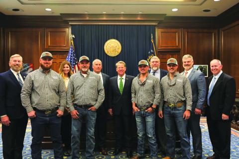 Submitted photo. Pictured (from left) are Terry Rogers; Robert Morris, team member; Mary Beth Horton, Community Relations Ambassador; Chris Chapman, team coach; Bryan Ferguson, HEMC President & CEO; Gov. Brian Kemp; Dillon Welborn, team member; Josh Allen, HEMC V.P., Engineering & Operations; Tucker Dyer, team member; Rep. Victor Anderson; and Tommy Thurmond HEMC V.P. Member & Community Relations.