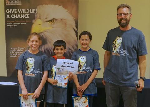 Photo courtesy of Chris May. Youth birding competition coordinator Tim Keyes poses with the Bufford Bluebirds team. For the first time in three years, the birding competition has returned, with the deadline for signups March 31.