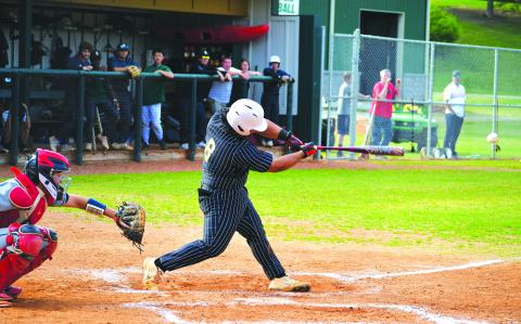 Luke Morey/The Clayton Tribune. Rabun Gap sophomore Jeffrey Diaz hits a double against Asheville Christian Academy on Thursday, April 6. Diaz also hit a home run on Tuesday, April 4 to help the Eagles win four straight games. 
