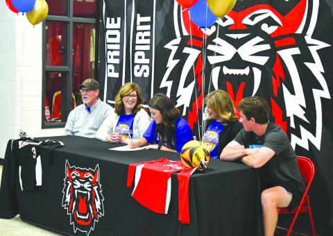 Luke Morey/The Clayton Tribune. On Monday, April 24, RCHS senior Abbye Carver signed her collegiate letter to play beach volleyball at Emmanuel College. Pictured from left, father Jim Carver, mother Tori Carver, Abbye, sister Miranda Hunnicutt and brother Grayson Carver. 