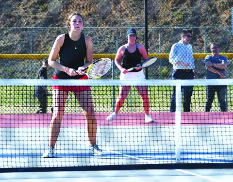Luke Morey/The Clayton Tribune. Sophomore Ruby Richardson (left) and senior Allana Jones helped the Rabun County tennis team win the region semi-final round, facing off against Tallulah Falls in the championship on Wednesday, April 12. 
