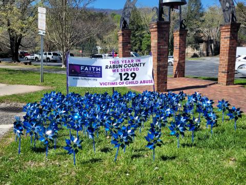 Megan Broome/The Clayton Tribune. Pinwheels on display in front of the Rabun County Courthouse represent 129 victims of child abuse who were served in Rabun County this year. Pinwheels are also on display at Rabun County Division of Family and Children Services. 