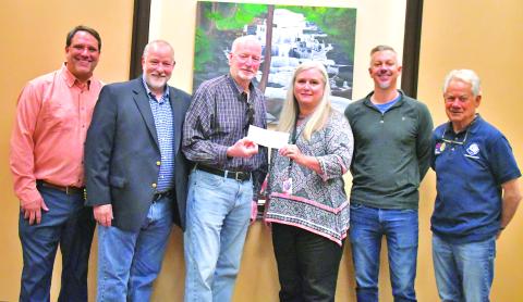 Megan Broome/The Clayton Tribune. Clayton Rotary Foundation, Inc. recently awarded a $20,000 grant to Rabun County Schools’ Needy Children’s Fund and presented the check to Superintendent Dr. April Childers. Pictured are Rotarian Todd Faircloth (left); Rotary President Leif Ericson; Rotarian and grant sponsor Matt Mitcham; Superintendent Dr. April Childers; Rotarian Eric Thurmond and Rotarian Ray Pagano. 