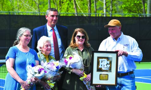 Luke Morey/The Clayton Tribune. From left, Ruth Arbitter Ebbs, Kathleen Arbitter, RGNS Head of School Jeff Miles, Jennifer Arbitter and Stephen Arbitter. During the re-dedication of Donald Arbitter tennis courts, the Arbitter family was honored with a Rabun Gap plaque in memory of Don Arbitter.