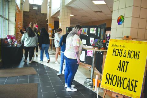 Megan Broome/The Clayton Tribune. Students at Rabun County Schools enjoy viewing the end-of-the-year RCMS/RCHS Art Showcase in the Fine Arts Building (FAB) Friday, May 12. 