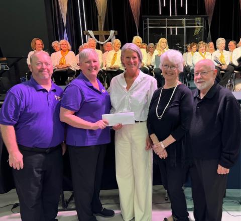 Submitted photo. Linda Sterrett, Brasstown Ringers director, presents a check for $1,200 raised for F.A.I.T.H. at the benefit concert in Clayton on April 29. Pictured are George James, Clayton First United Methodist Church; Linda Sterrett, Brasstown Ringers Director; Sarah Charity, F.A.I.T.H. Director; Beverly Barnett, Mountain Voices Director; and Graham Bethel, Pinnacle Brass Director.  