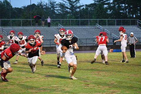 Luke Morey/The Clayton Tribune. Rising Rabun County sophomore Ty Truelove gets the angle on a quarterback keeper against rising sophomore Levi Bartram during the Thursday, May 18, Spring Game. The Wildcats begin their defense of the Class A Division 1 Region 8 title in August.
