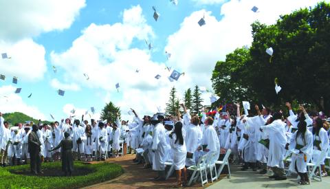 Luke Morey/The Clayton Tribune. The 100 Rabun Gap graduates toss their caps in the air on Sunday, May 21, as they celebrate their graduation. The commencement ceremonies also included a baccalaureate speech, given by Rev. Dr. Jeffry Lynn Reynolds. The Rabun Gap seniors helped achieve two back-to-back state championships as well as the Shuler Award for the arts program, on top of all 100 earning acceptance into a four-year college or university. 