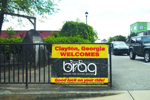 Luke Morey/The Clayton Tribune. A sign welcoming the riders for Bicycle Ride Across Georgia is located along Main Street in Clayton. The City of Clayton will host the BRAG riders as the ride begins on Sunday, June 4. This will be the first time Clayton has hosted the first night of the BRAG, and the first time BRAG has come to Rabun County since 2012 when the ride ended at Rabun County High School in Tiger, Ga.