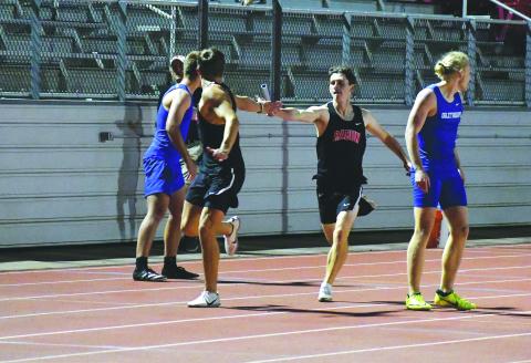 Luke Morey/The Clayton Tribune. In a meet earlier in the season, Hayden Deslich hands off the baton to Rabun County High School 4X400-meter relay teammate Paul Picciotti. The team of Deslich, Picciotti, Hayden Smith and Willie Goodwyn raced to a 3:34.10 in the state Class 1A Division I sectional to set a season record as the Wildcats placed third.