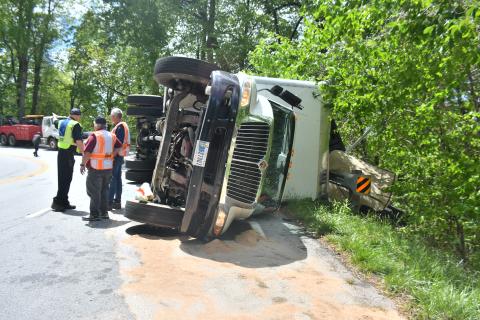 Megan Broome/The Clayton Tribune. Sky Valley Police Chief Vaughn Estes, Sky Valley-Scaly Mountain Volunteer Fire & Rescue Chief Ken Sigler and firefighters analyze the crash scene on Highway 246 just past Sky Valley Overlook in Macon County, North Carolina limits Monday, May 1. 
