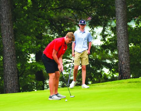 Luke Morey/The Clayton Tribune. RCHS top finisher Jack Hood lines up a putt at the state golf championship on Tuesday in Elberton. 