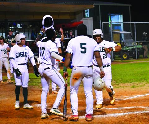 Luke Morey/The Clayton Tribune. Rabun Gap sophomore catcher Jeffrey Diaz (21) celebrates crossing the plate after hitting a grand slam that scored senior Armani Guzman (5), sophomore Denajh Williams (17) and senior Keesean Campbell (1). Diaz is leading the team with six home runs on the season. 