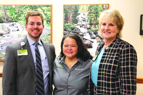 Submitted photo. Lidia Sorto has been with Northeast Georgia Health System (NGHS) for 16 years, and was named Employee of the Year for her work in nutrition services. From left are Kevin Matson, vice president of oncology, orthopedic and rehabilitation services for NGHS; Lidia Sorto, cashier with nutrition services; Carol Burrell, president & CEO of NGHS.