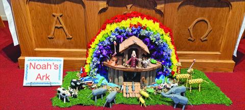 Megan Broome/The Clayton Tribune. This depiction of Noah’s Ark in colorful flowers and crafted animals was created by parishioners at St. James Episcopal Church and arranged in front of the altar during the Flower and Liturgical Festival. 