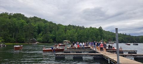 Megan Broome/The Clayton Tribune. Hundreds of people show out to LaPrade's Marina at Lake Burton to view wooden boats on display following the annual Memorial Day parade.