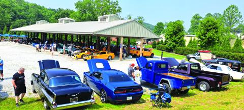 Megan Broome/The Clayton Tribune. The Inaugural "Rumble in Rabun" car and bike show featured 106 entires. Spectators locally, from around the region and surrounding states attended the event. Left: Show judge Jason Whitmire talks with Bruce Martin from Rabun Gap about his Wood Doodlebug Chevette. 