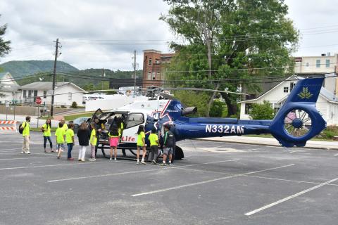 Megan Broome/The Clayton Tribune. Air Life personnel talk to students about what they do and allow them to see the inside of the helicopter first-hand.