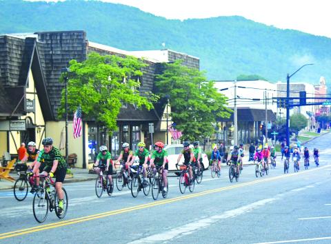 Luke Morey/The Clayton Tribune. Some of the 1,000 cyclists roll on South Main Street on June 4 in Clayton to start the first segment of the BRAG route through Rabun County.