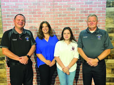 Submitted photo. RCHS graduate Taylor Rogers successfully completed the Emergency Medical Responder (EMR) Course and passed her National Registry Exam. Pictured are Trampes Stancil, instructor; Alicia McCracken, RCHS health science teacher; Rogers; and Mike Carnes, EMS/911 director. 