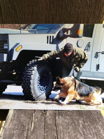 Submitted photo. K9 Handler John Crane works with partner K9 Pinda during their  law enforcement career. The pair worked as a team from 2010-2017. Pinda recently passed away at age 14.
