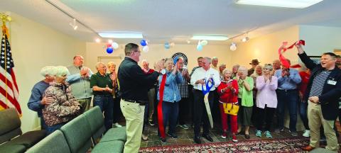 Megan Broome/The Clayton Tribune. City of Sky Valley officials, community members and Forward Rabun/Rabun County Chamber of Commerce cut the ribbon on the new location for Sky Valley City Hall Friday, May 26. 