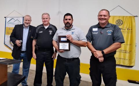 Megan Broome/The Clayton Tribune. Rabun County EMS Paramedic Jon Wilbanks is presented with the Clayton Rotary Club EMT/Paramedic of the Year award by Rotary Club of Clayton President Leif Ericson at a recent club meeting. Also pictured to celebrate Wilbanks’ accomplishments are EMS/911 Director Mike Carnes and Captain Trampes Stancil.