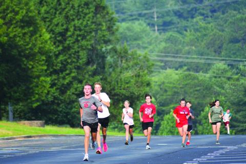 Enoch Autry/The Clayton Tribune. Hayden Smith finishes strong during the running of one of the cross country team’s 200-meter dashes.