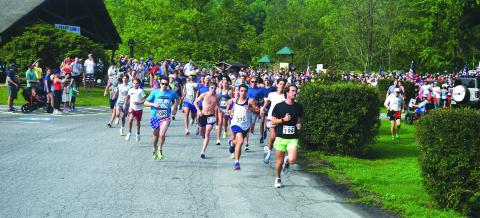 Luke Morey/The Clayton Tribune. A total of 1,300 runners participated in the 39th annual Lake Burton Fun Run on Saturday, July 1. Noah Schaich (bib number 1099) took first place. 