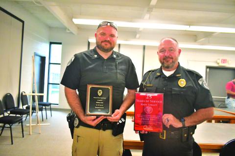 Megan Broome/The Clayton Tribune.  Clayton Police Department Sgt. William Wall and Chief Andy Strait were recognized for 10 years and 25 years of service respectively during Tuesday’s Clayton City Council meeting. Both officers were presented with appreciation plaques and honored during the meeting. 