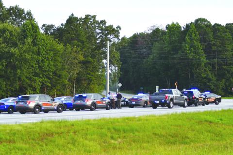 Enoch Autry/The Clayton Tribune. Patrol cars from multiple law enforcement agencies line U.S. 441 in Habersham County where a Louisiana man was taken into custody after a multi-county chase that started in Rabun on Aug. 21.